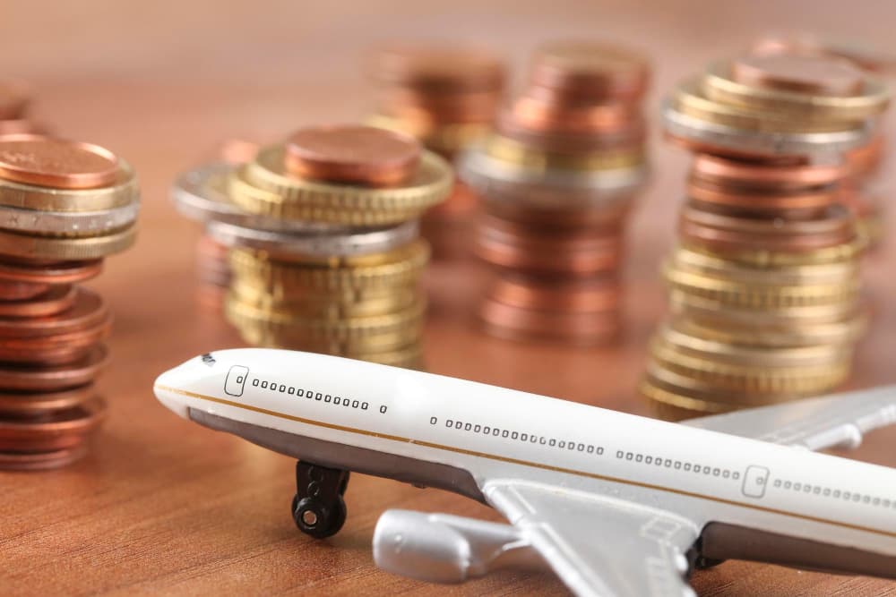 Best Time to Book Flights with calendar and airplane icons showing cheap travel dates