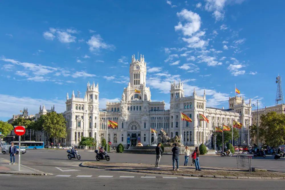 Madrid Barajas Airport terminal with travelers during an international flight layover