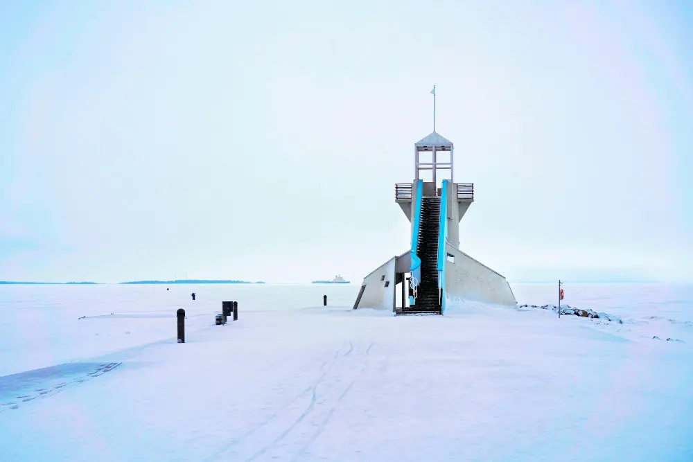 Trending European destinations showcasing Oulu’s frozen sea landscape and winter coastal architecture.