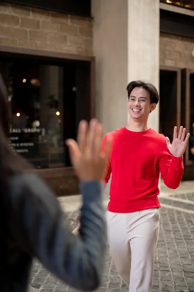 Tourist standing too close to a local in a public setting, highlighting cultural differences in personal space