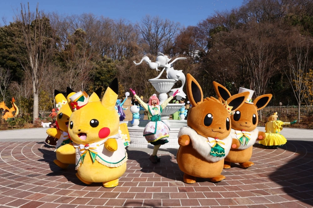 PokéPark KANTO live character experience featuring Pikachu and Eevee during an outdoor performance