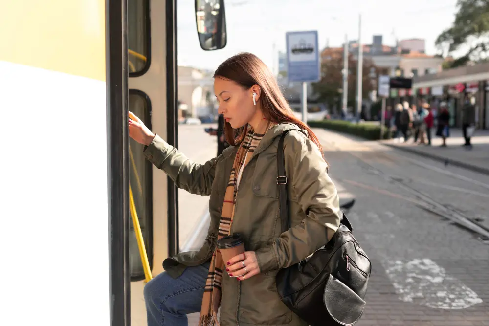 Traveler wearing a seatbelt inside a taxi while using a navigation app for safe transportation abroad