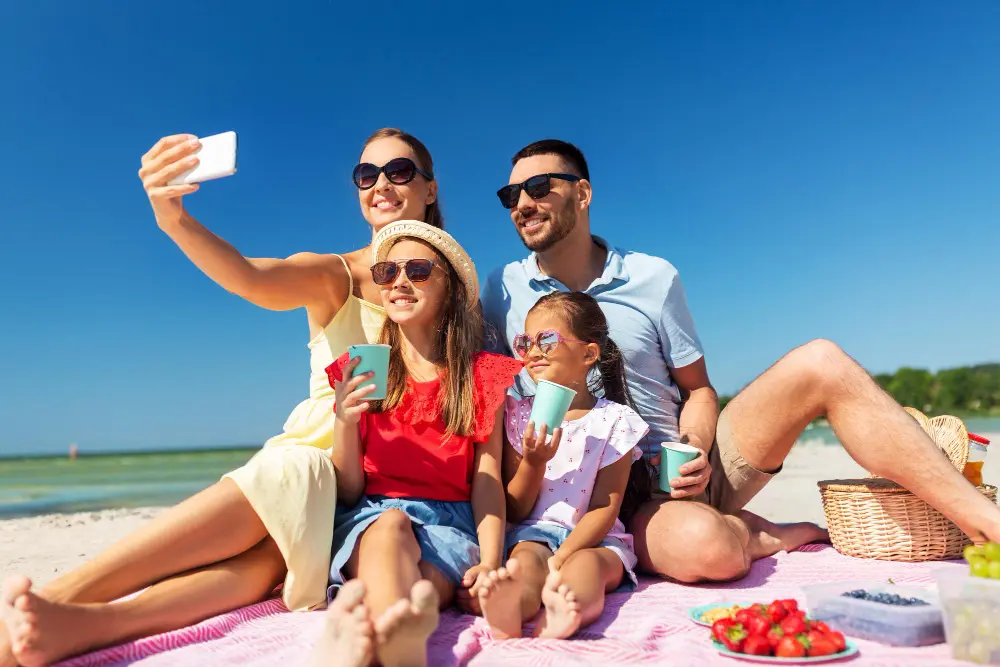 Family enjoying budget-friendly spring break vacation at the beach with kids playing in sand, representing best spring break destinations for families on a budget