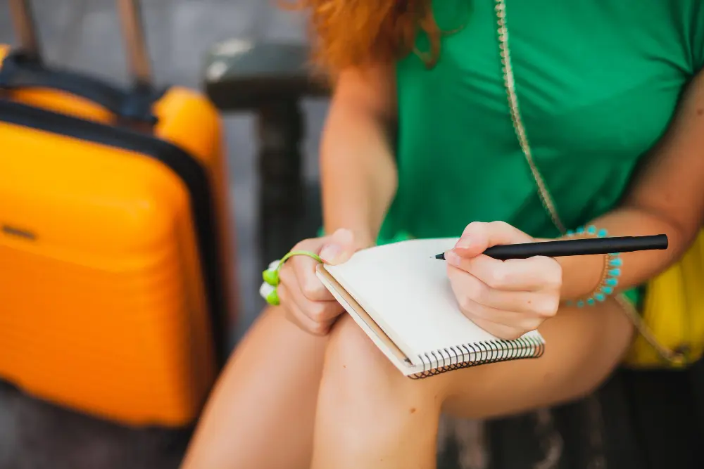 how to plan a budget trip by tracking spending during the trip with phone budget app and travel notes