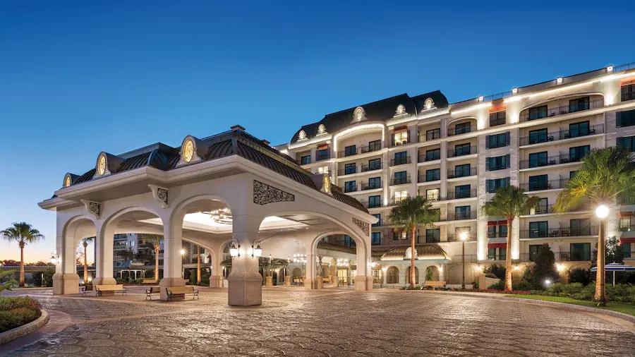 Family relaxing at Disney resort pool during rest day included in itinerary for Disney World vacation