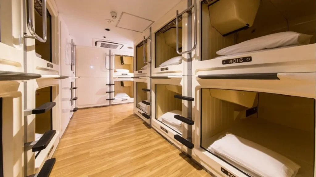 A cozy traditional ryokan room with tatami mats next to a modern capsule hotel, illustrating how much does it cost to travel japan.
