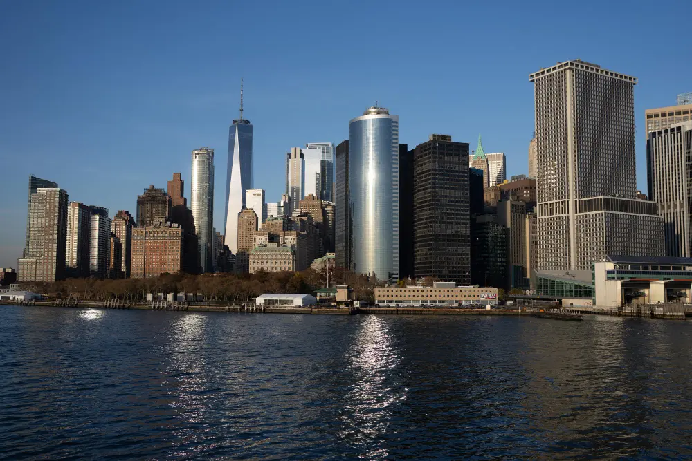 Colorful street view of a New York City neighborhood with brownstone buildings, ideal for first-time visitors deciding where to stay