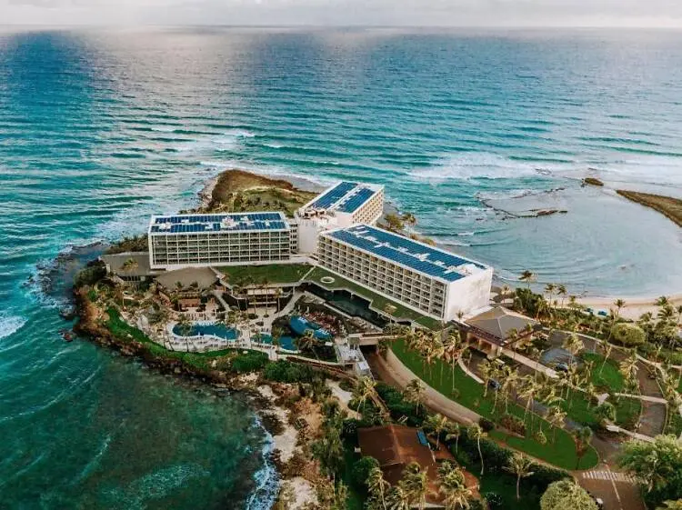 Person marking travel dates on a calendar to plan how far in advance to book round trip plane tickets to Hawaii and get the best price in 2026