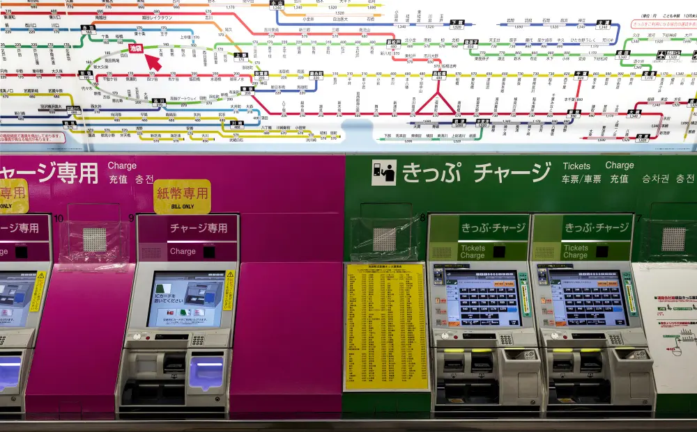 A high speed Shinkansen bullet train at a station platform in Tokyo, representing one of the main transportation costs when planning how much to travel to japan.
