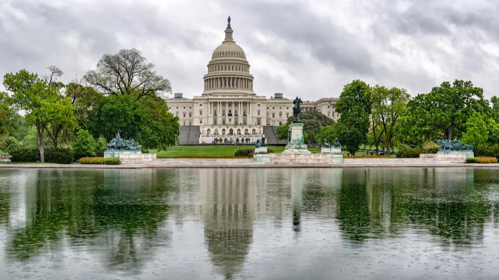 A panoramic view of the National Mall at sunset showing how to plan a trip to Washington DC.